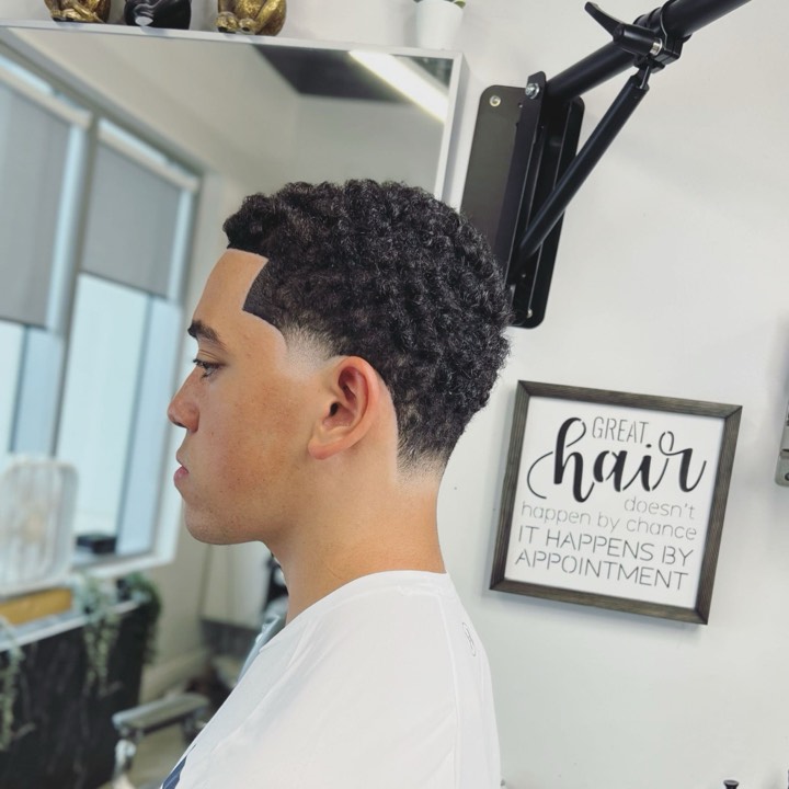 Taper fade blended into natural curls — Dope Fades