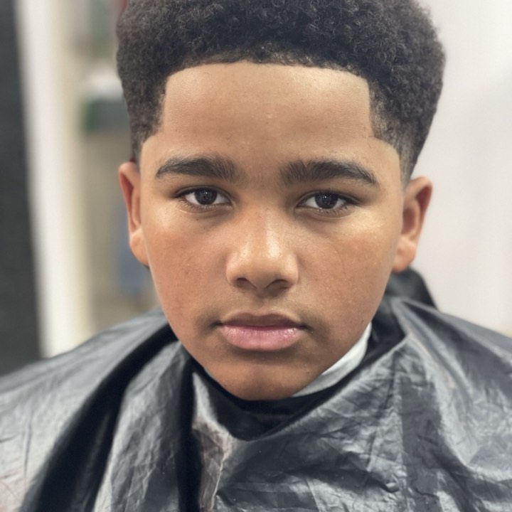 Curly top shaped and lined up in the chair — Dope Fades