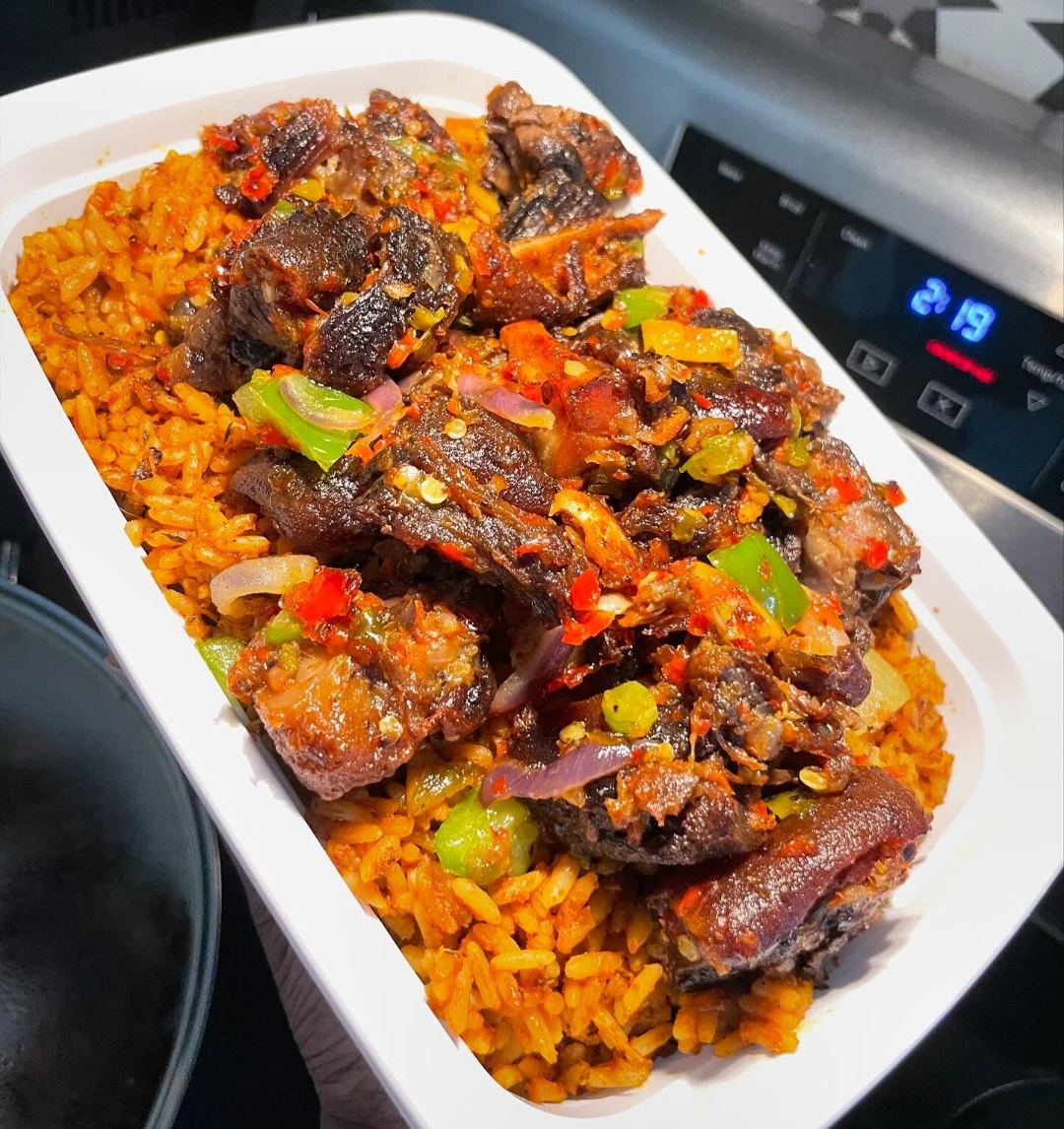 Jollof rice topped with peppered beef